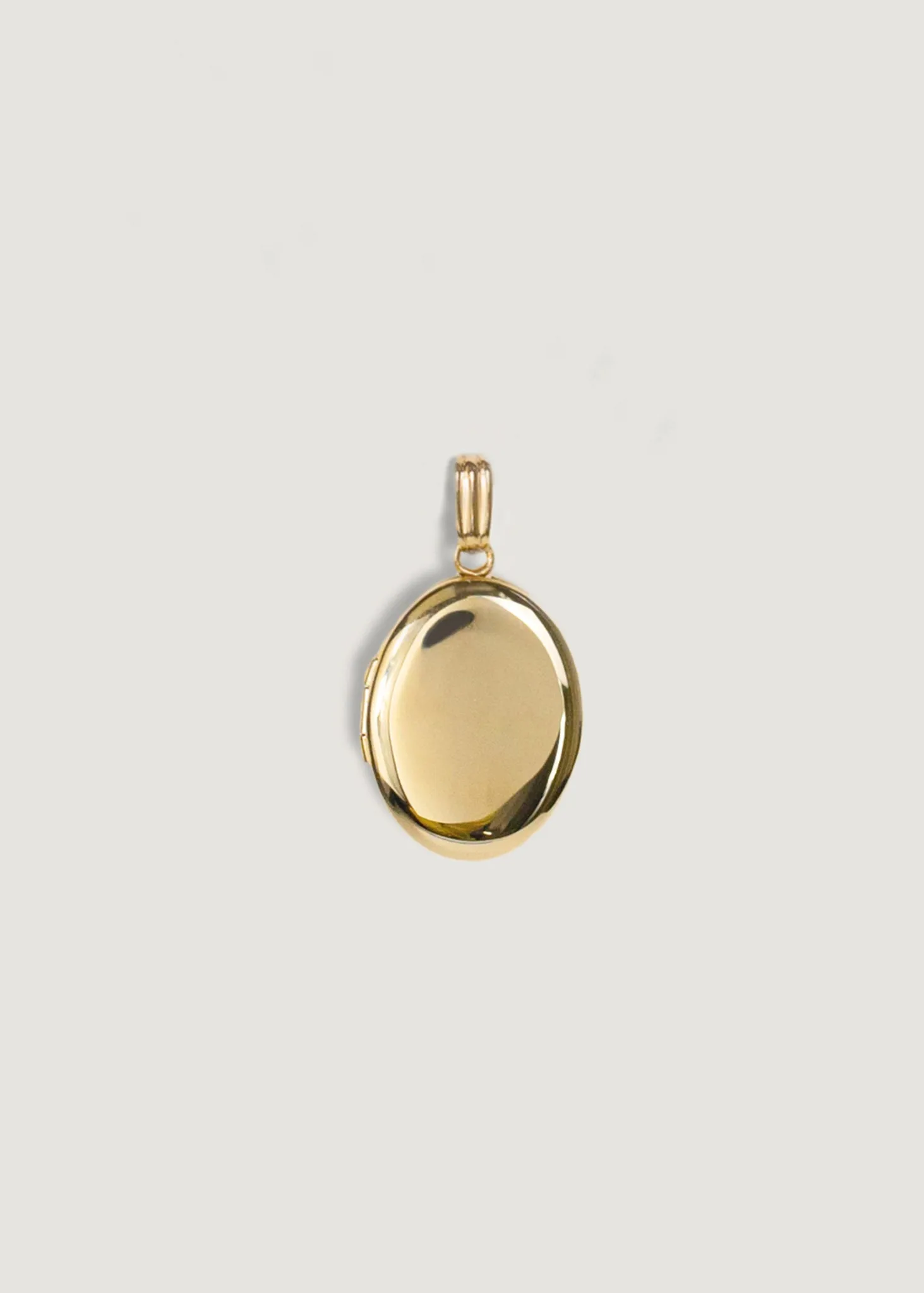 Maison Oval Locket sold by Kinn