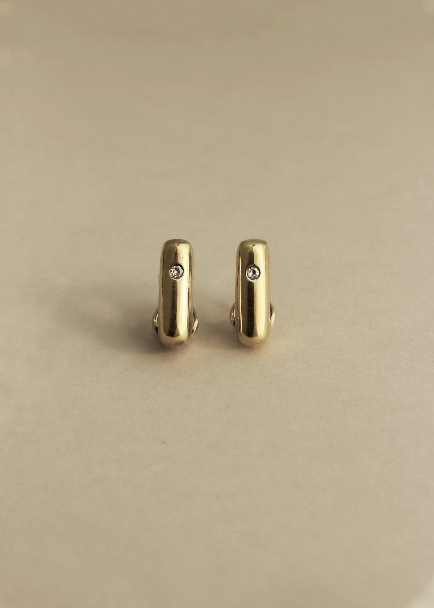 Vintage 18K Gold Tubular Hoops with Diamond sold by Kinn