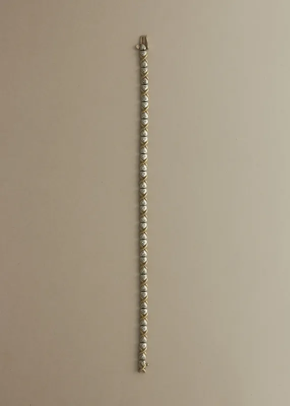 Vintage 10K Two Tone X Link Tennis Bracelet sold by Kinn