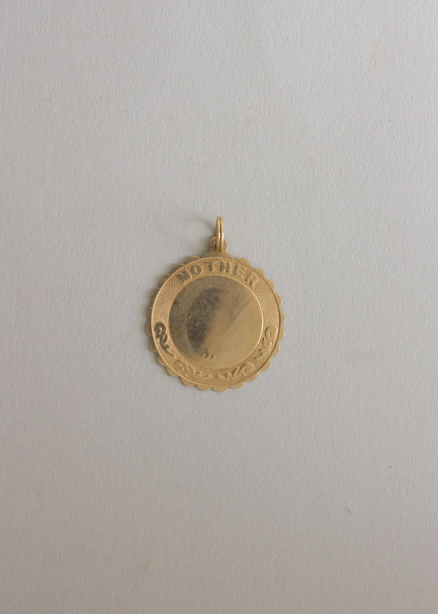 Vintage Mother Coin Pendant sold by Kinn