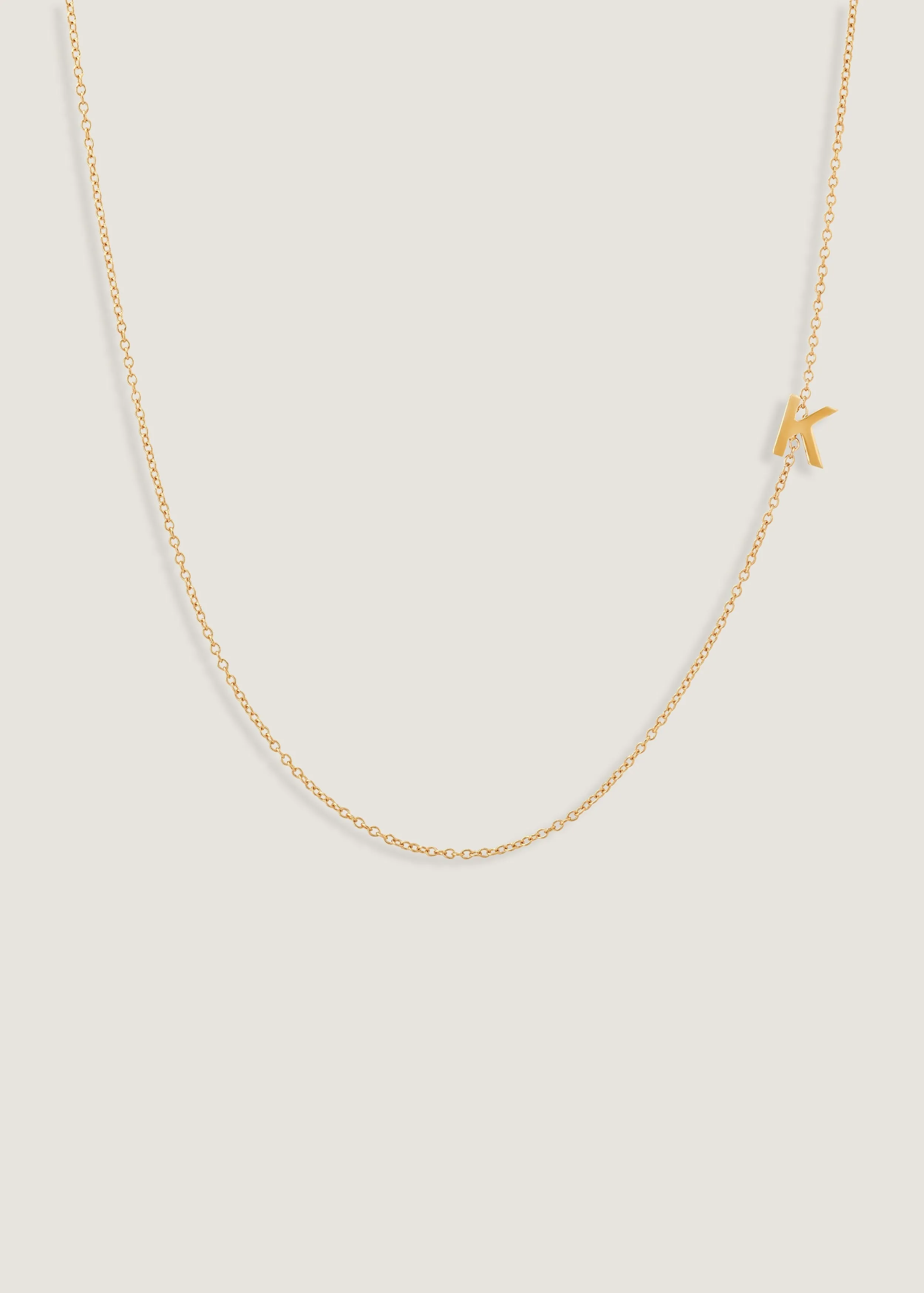 Asymmetrical Single Initial Necklace sold by Kinn