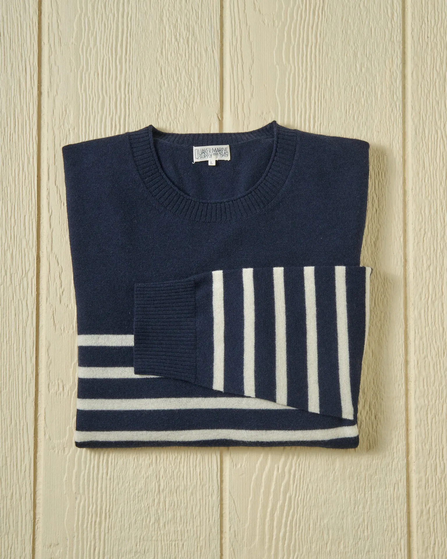 Merino Roll Neck Sweater in Navy/Egret Placed Stripe sold by Quaker Marine Supply