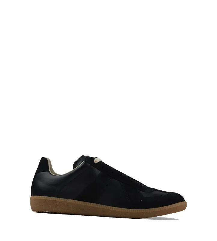Maison Margiela Replica Sneakers in Black sold by FOUR Amsterdam