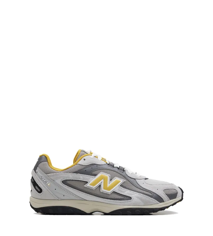 New Balance 2004L Sneakers in Grey and Yellow sold by FOUR Amsterdam