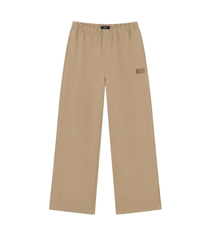 Patch Cady Track Pants Dark Sand made by AMIRI