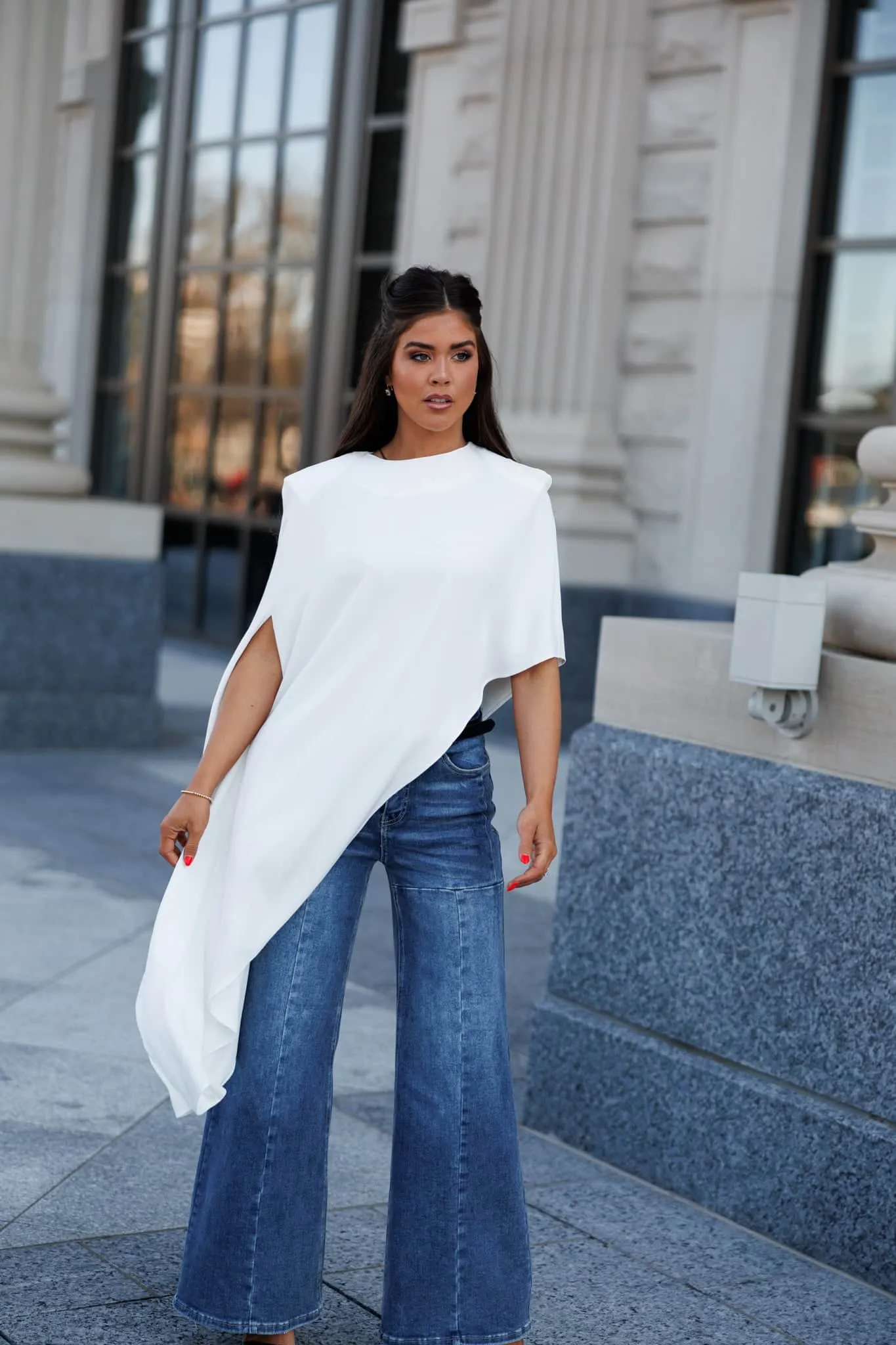 Asymmetrical Cape Top sold by LANE 201