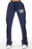 Kendra Navy Fringe Stacked Flare Track Pant sold by Rockstar Original