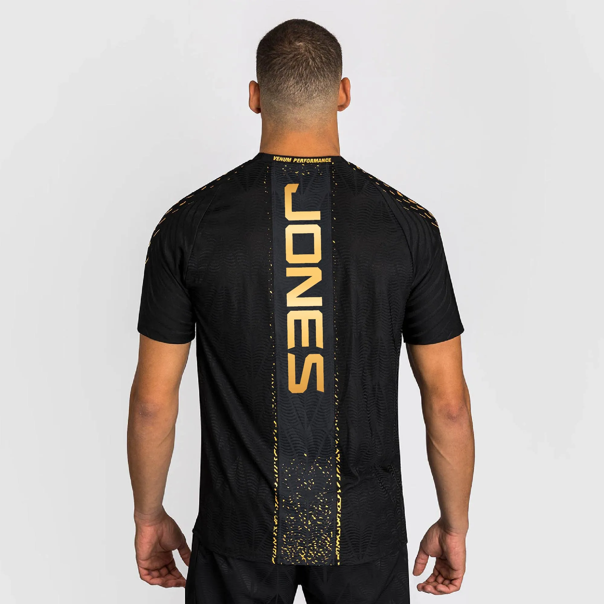 Men's UFC Zenith by Venum Black/Gold Jon Jones Authentic Fight Night Champion Walkout Jersey sold by UFC