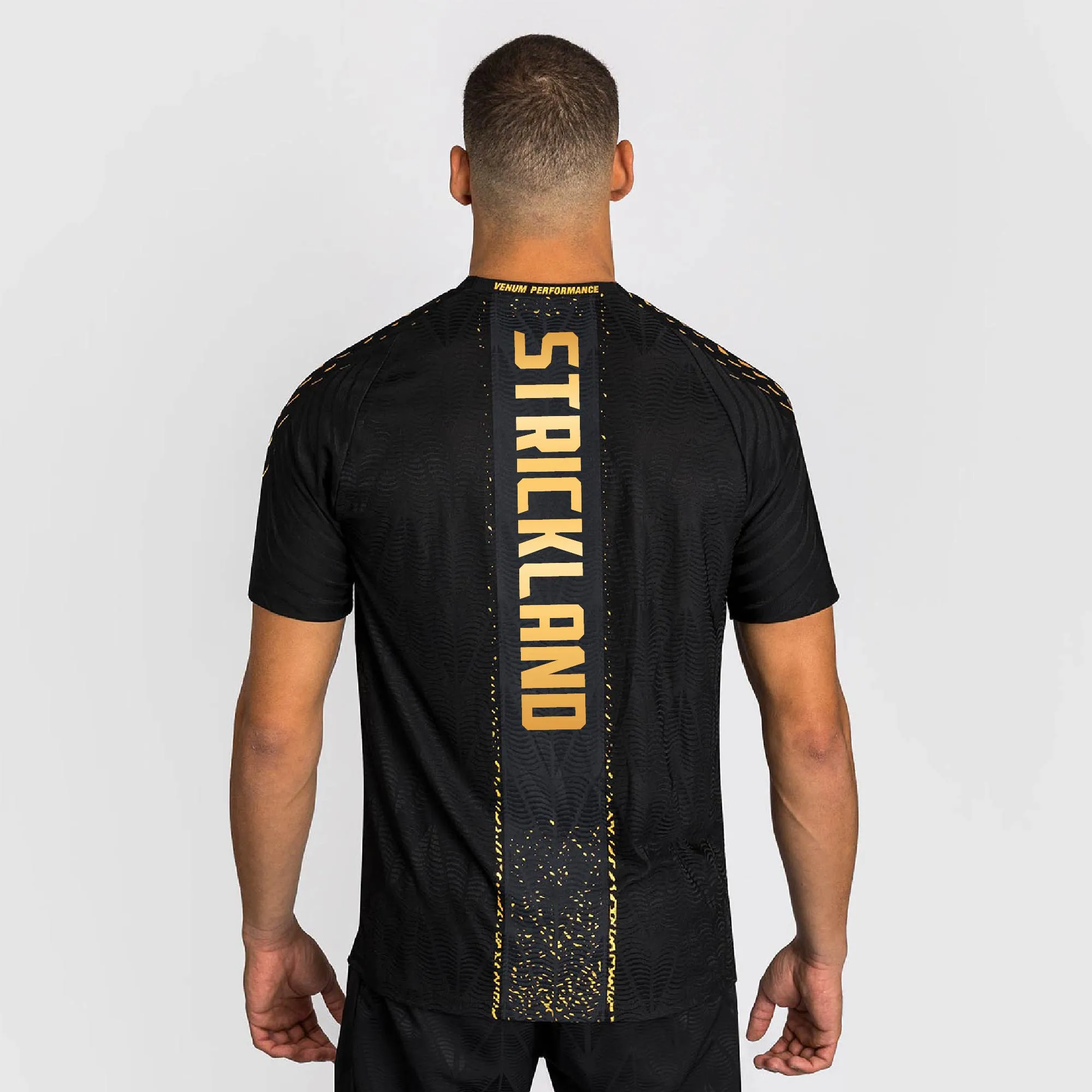 Men's UFC Zenith by Venum Sean Strickland Black/Gold Authentic Fight Night Champion Walkout Jersey sold by UFC