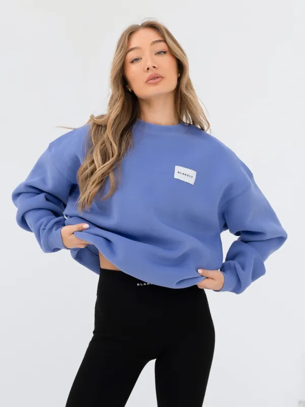 Label Oversized Jumper - Lilac Blue sold by Blakely