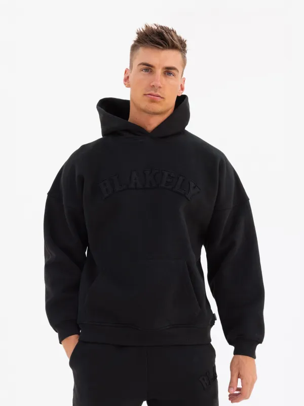 Tonal Varsity Relaxed Hoodie - Black sold by Blakely