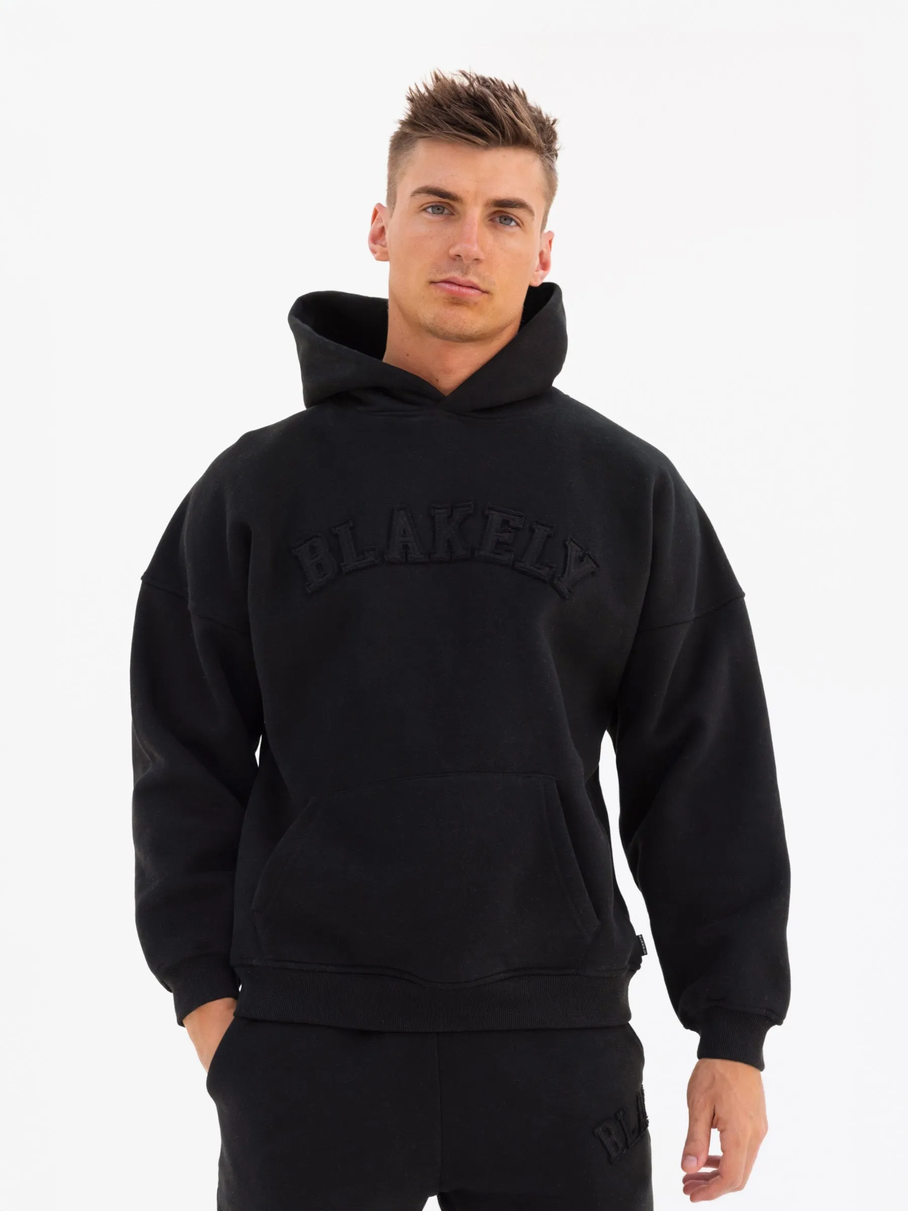 Tonal Varsity Relaxed Hoodie - Black sold by Blakely