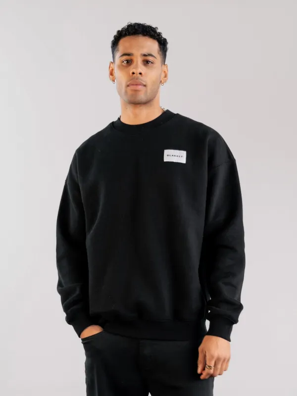 Label Relaxed Jumper - Black sold by Blakely