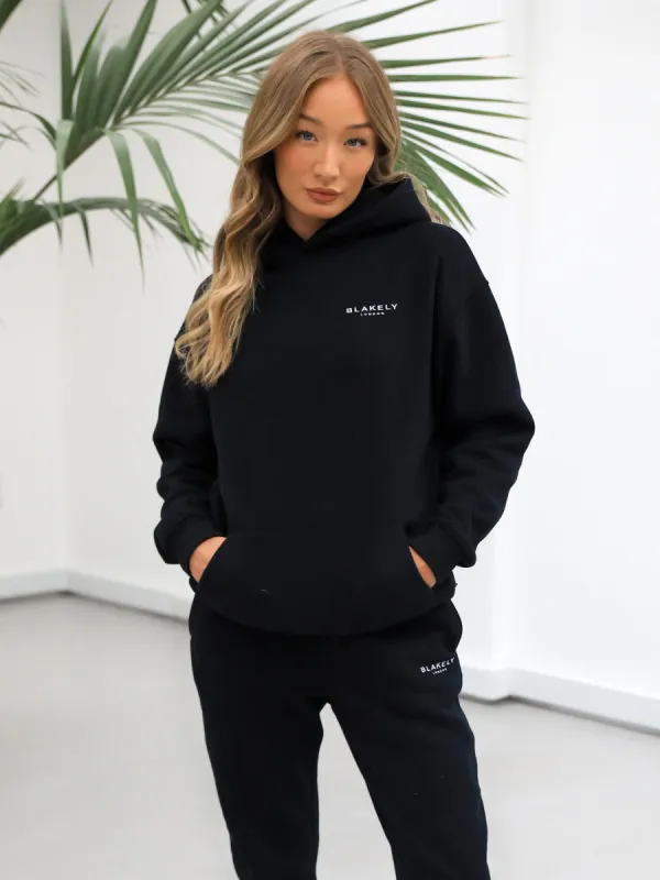 Universal Women's Relaxed Hoodie - Black sold by Blakely