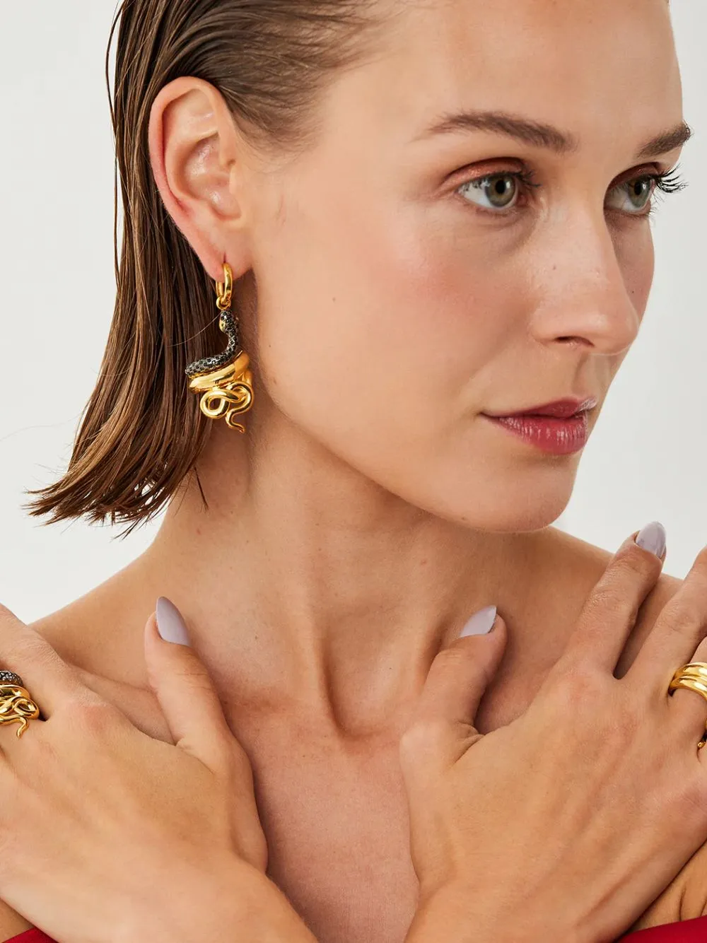 Gold-Plated Serpentino Hoop Earrings in Black sold by Fashion Clinic