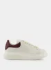 Off White and Bordeaux Oversized Sneakers sold by Fashion Clinic