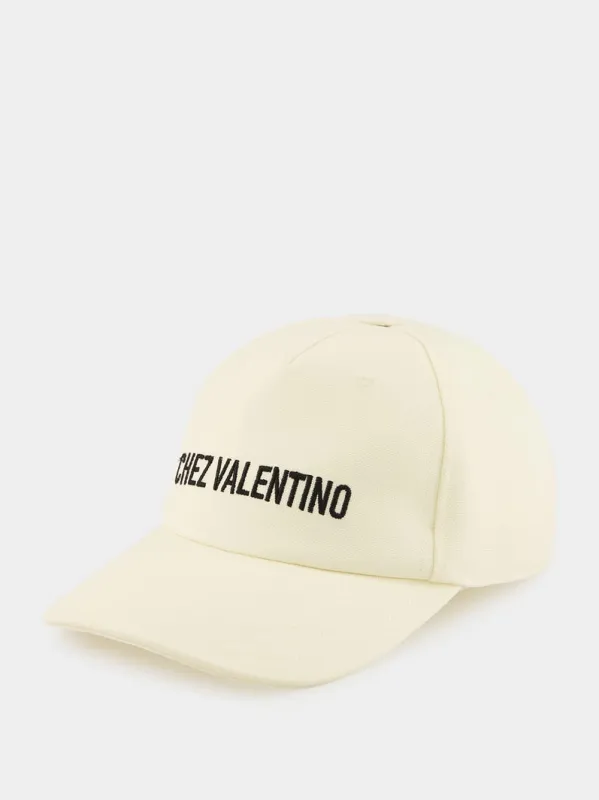 Ivory Cap Chez Valentino with Black Logo sold by Fashion Clinic