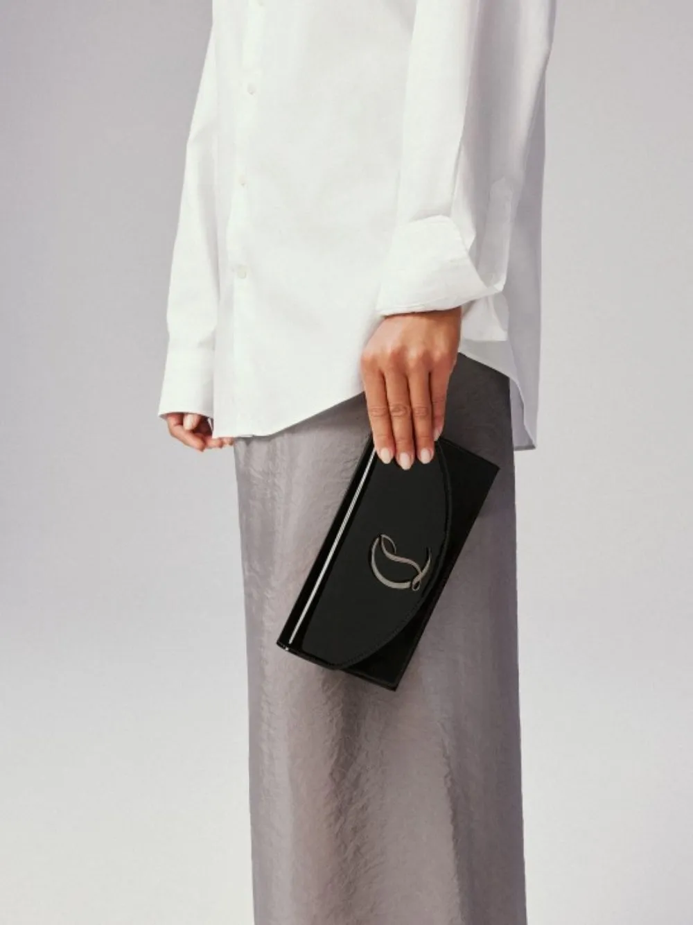 Black Loubi54 Clutch Bag sold by Fashion Clinic