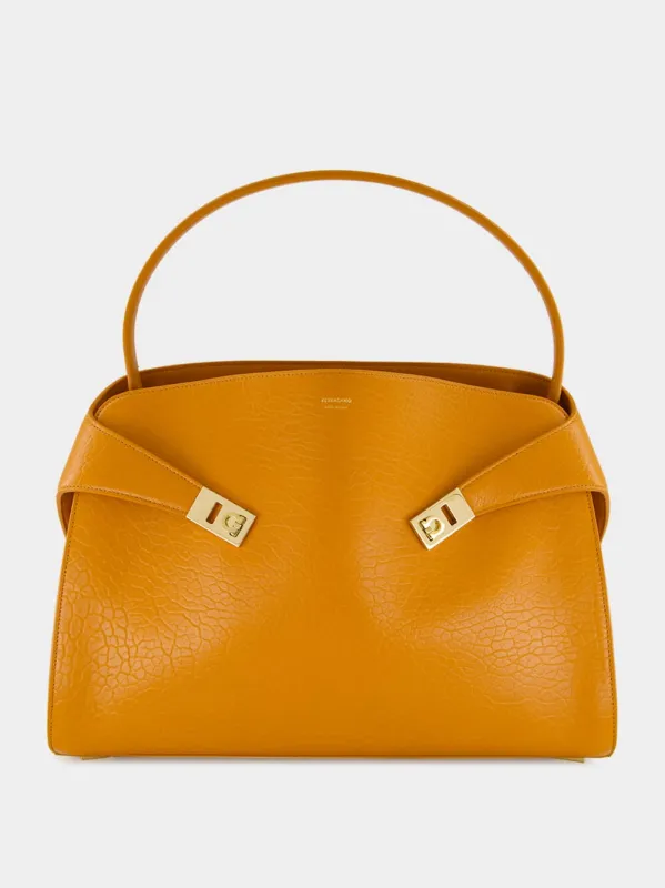 Hug Shoulder Bag in Dark Honeycomb Leather sold by Fashion Clinic