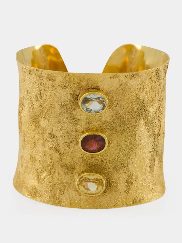 Gold Cuff Bracelet with Rubellite and Topaz sold by Fashion Clinic