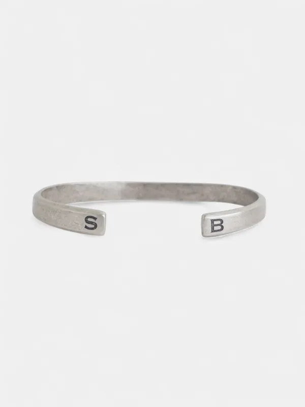 Engraved metal bracelet made by Silbon