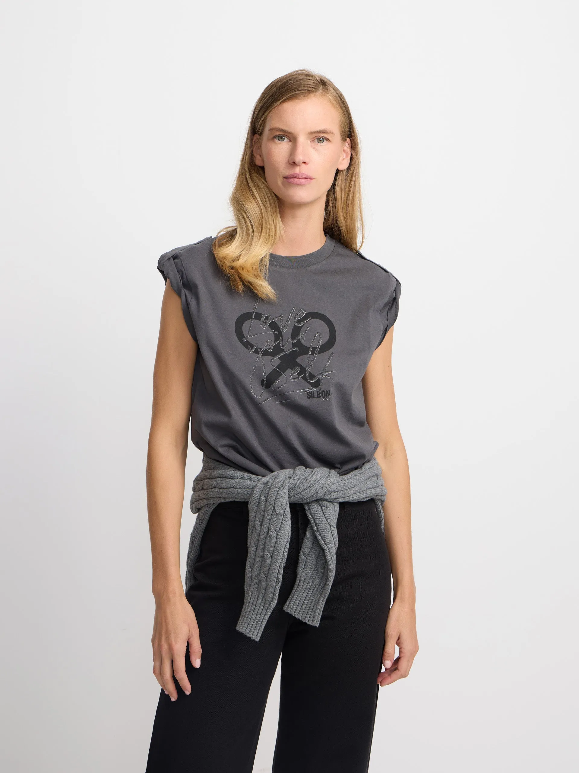 Women's black roll out sleeve t-shirt sold by Silbon