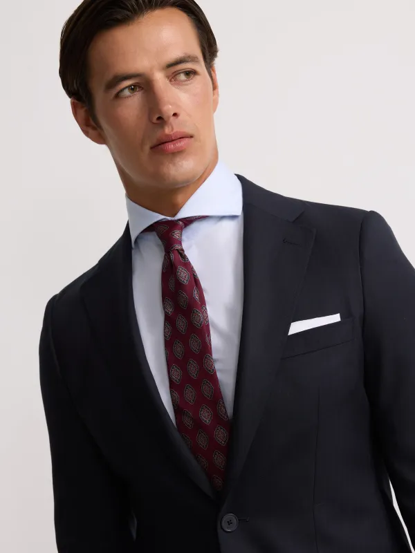 Classic navy blue herringbone suit jacket sold by Silbon