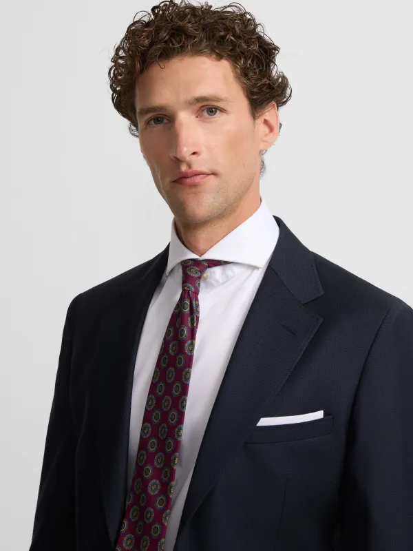 Navy blue structured suit jacket sold by Silbon