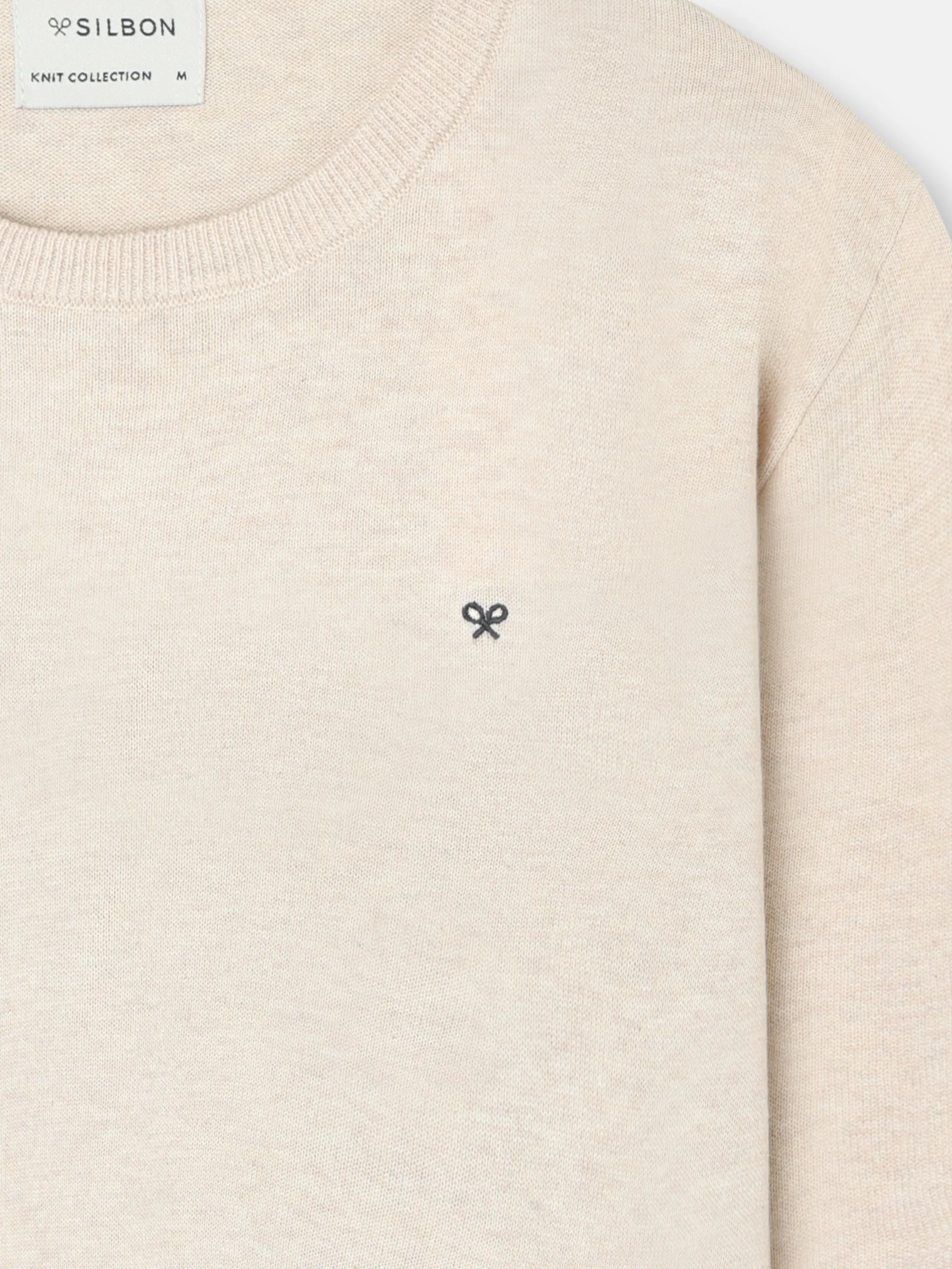 Plain cream crew neck sweater sold by Silbon