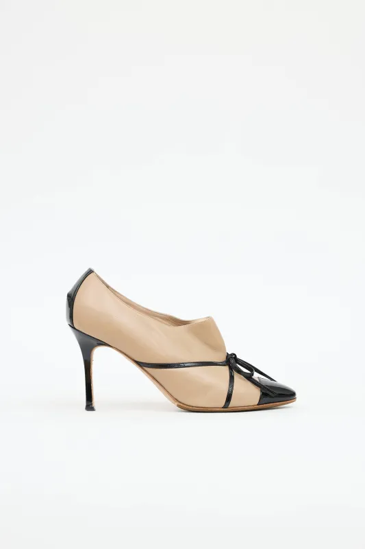 Patent Bow Booties sold by VSP Consignment