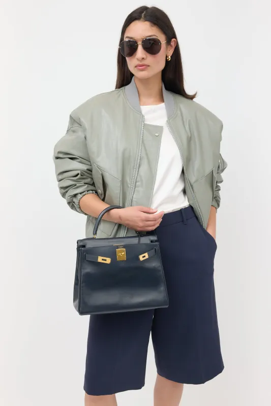 Vintage Navy Box Kelly Retourne 28 Bag sold by VSP Consignment