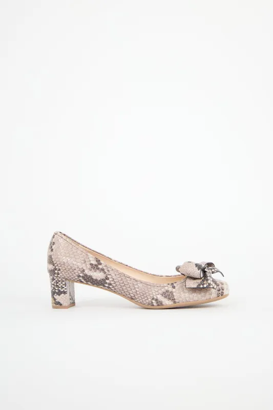 Sport Leather Bow Pump sold by VSP Consignment