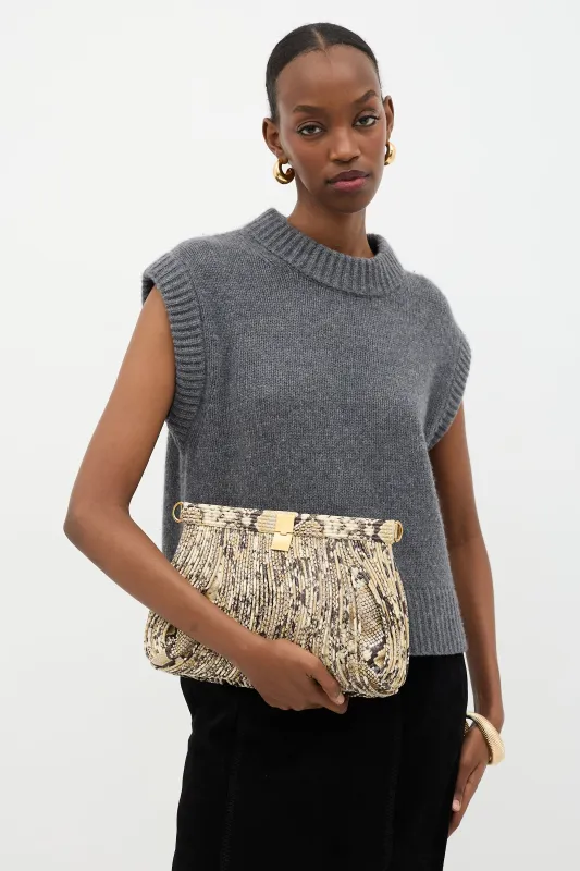 Embossed Leather Rolo Clutch sold by VSP Consignment