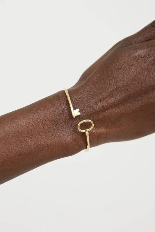 18K Gold Key Wire Bangle sold by VSP Consignment