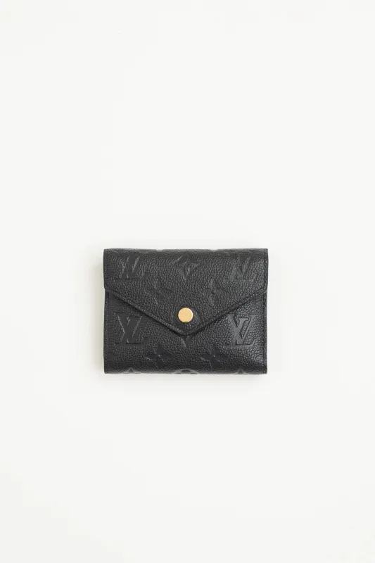 Empriente Victorine Monogram Wallet sold by VSP Consignment