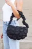 Indy Convertible Quilted Puffer Crossbody sold by Madison + Mallory