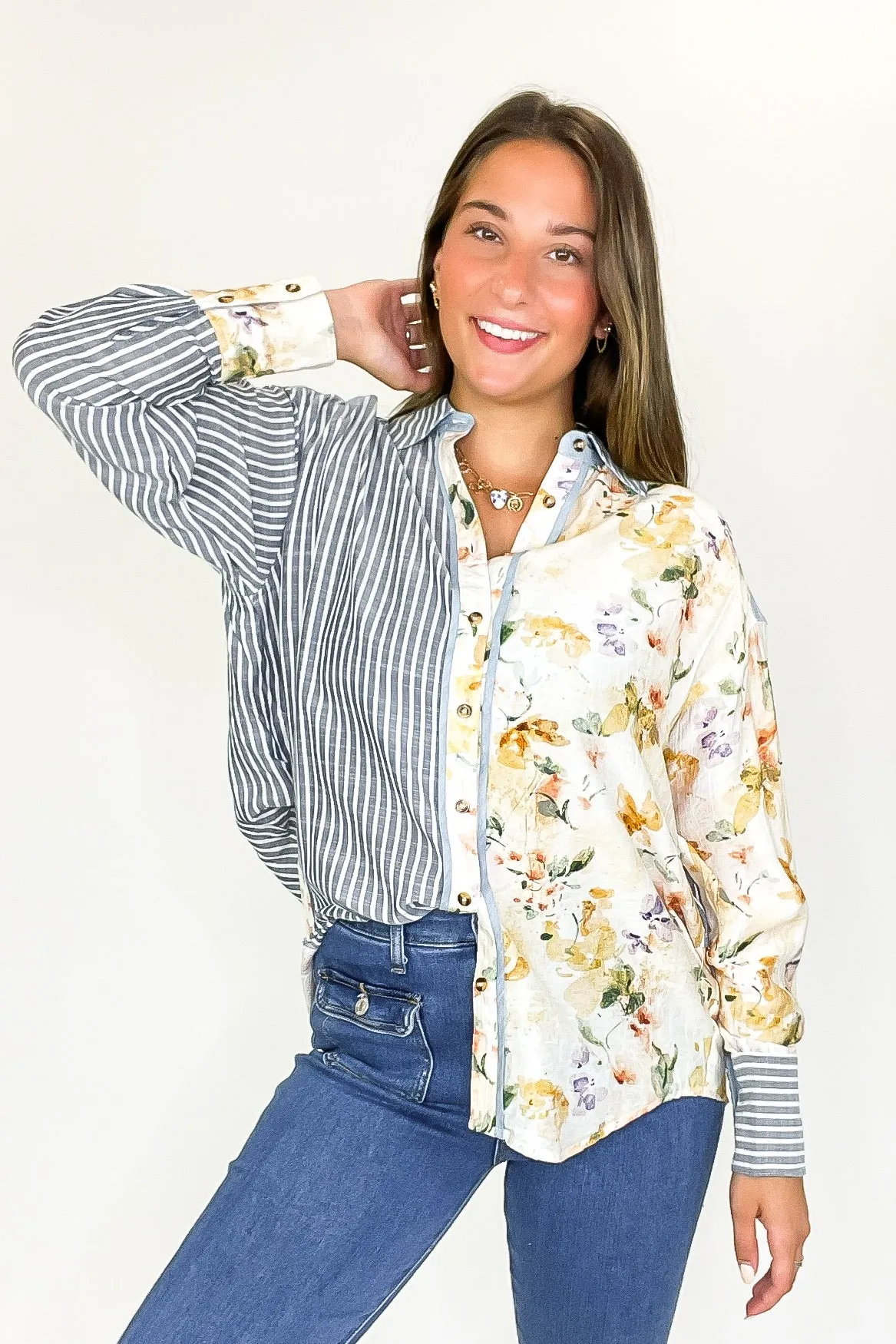 Garden Lines Relaxed Fit Long Sleeve Striped And Floral Top sold by Madison + Mallory