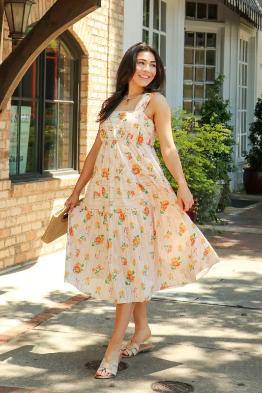 The Petal Tier Floral Print Smocked Midi Dress made by Doe & Rae
