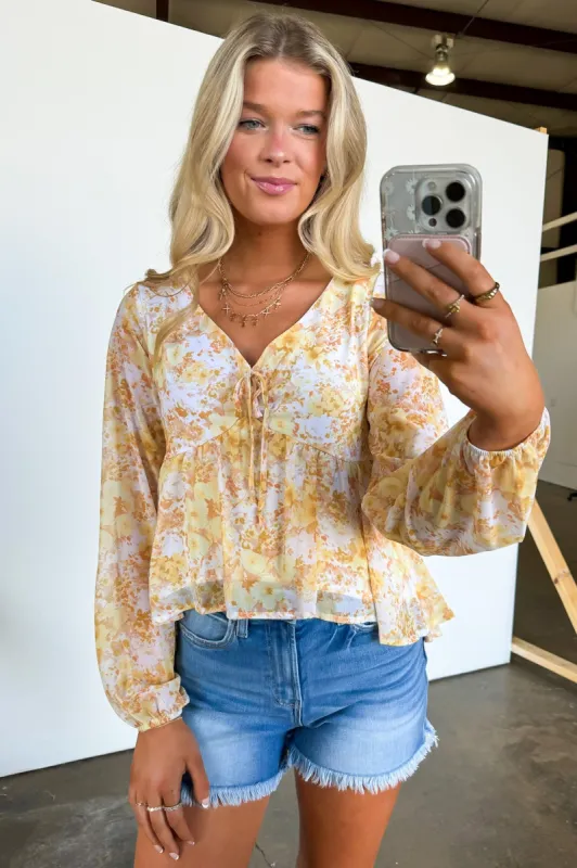 Elegant Ease Floral Print Swing Top sold by Madison + Mallory