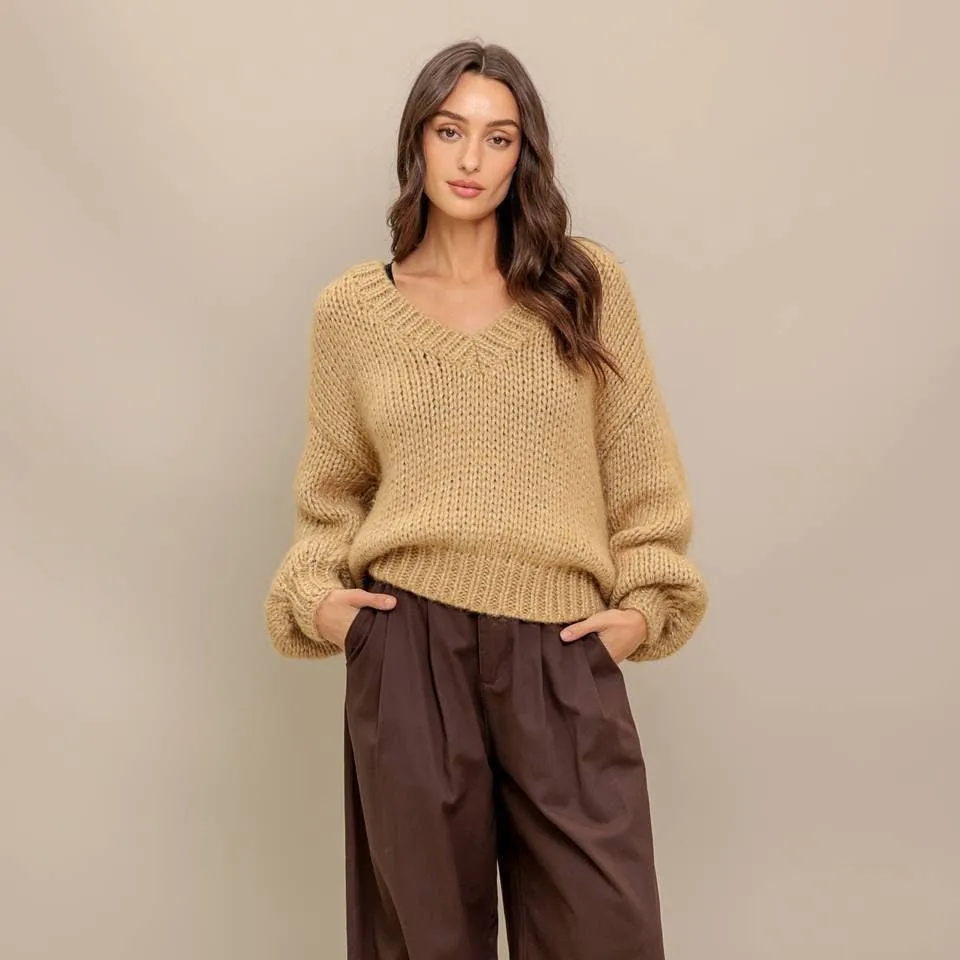 A sweater knit top sold by Oceanne