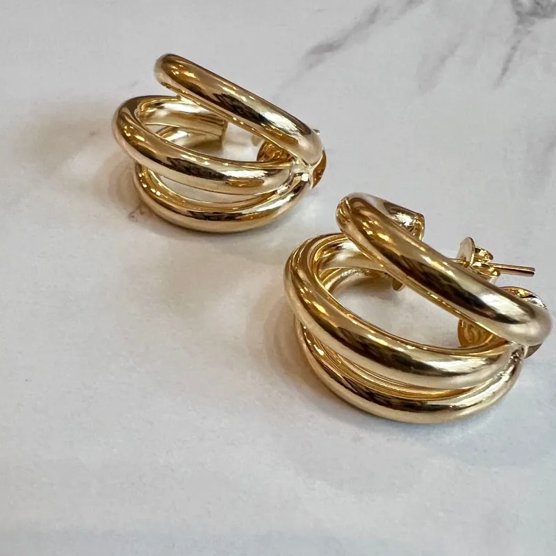 Trois Huggie Hoops made by Oceanne