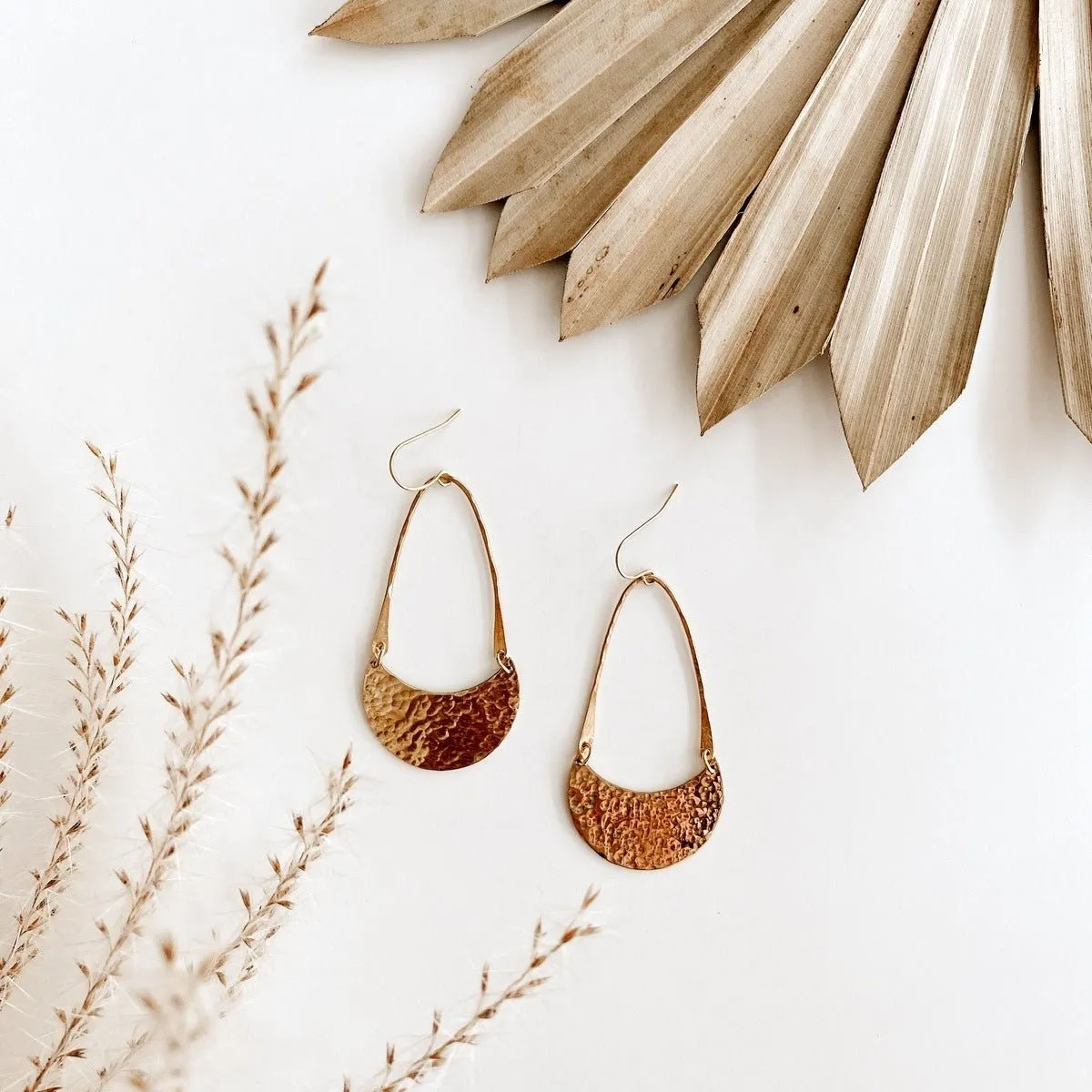 hammered moon earrings sold by Oceanne