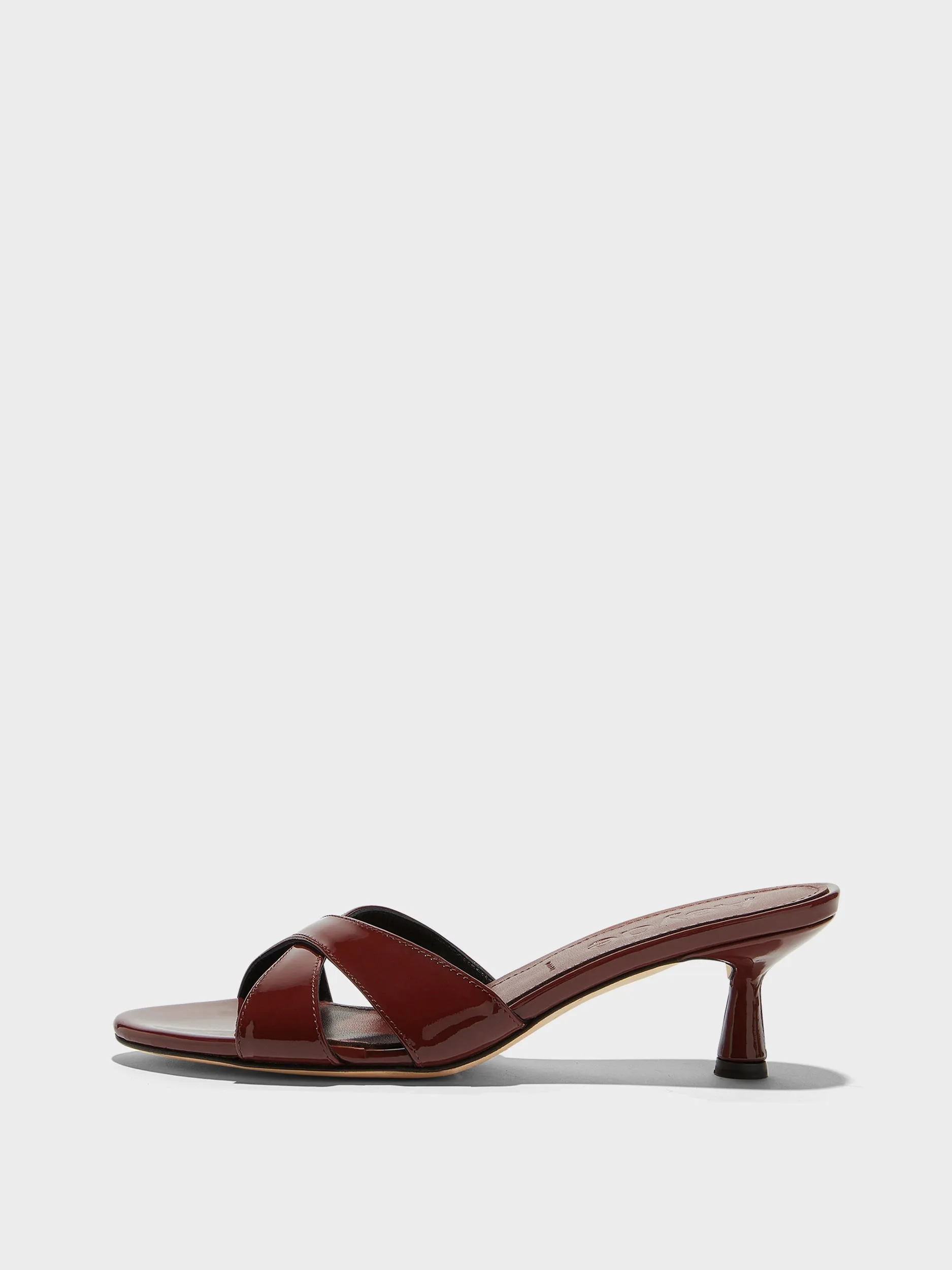 Vero Patent Leather Mules sold by Aeyde