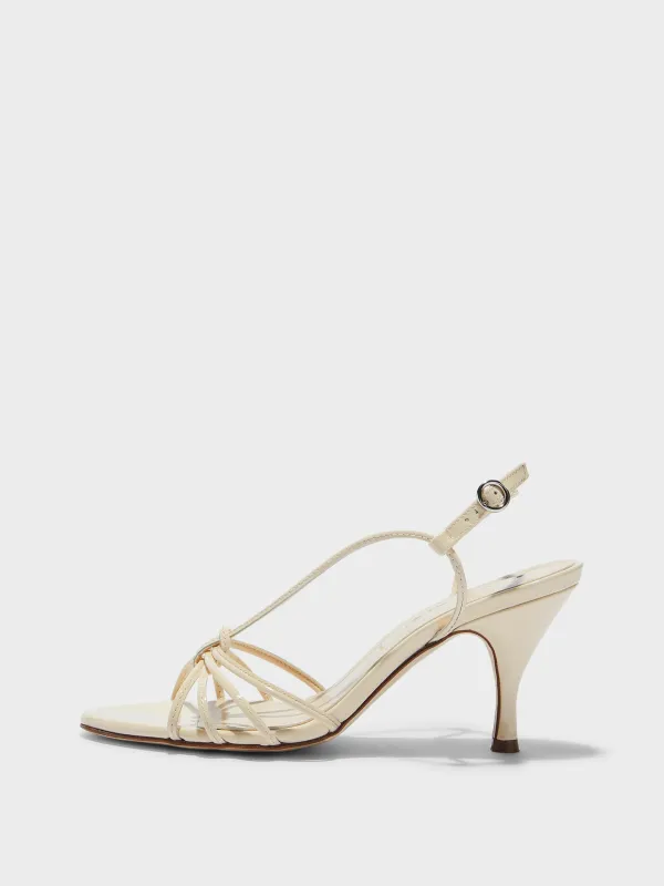 Solange Patent Leather Sandals sold by Aeyde