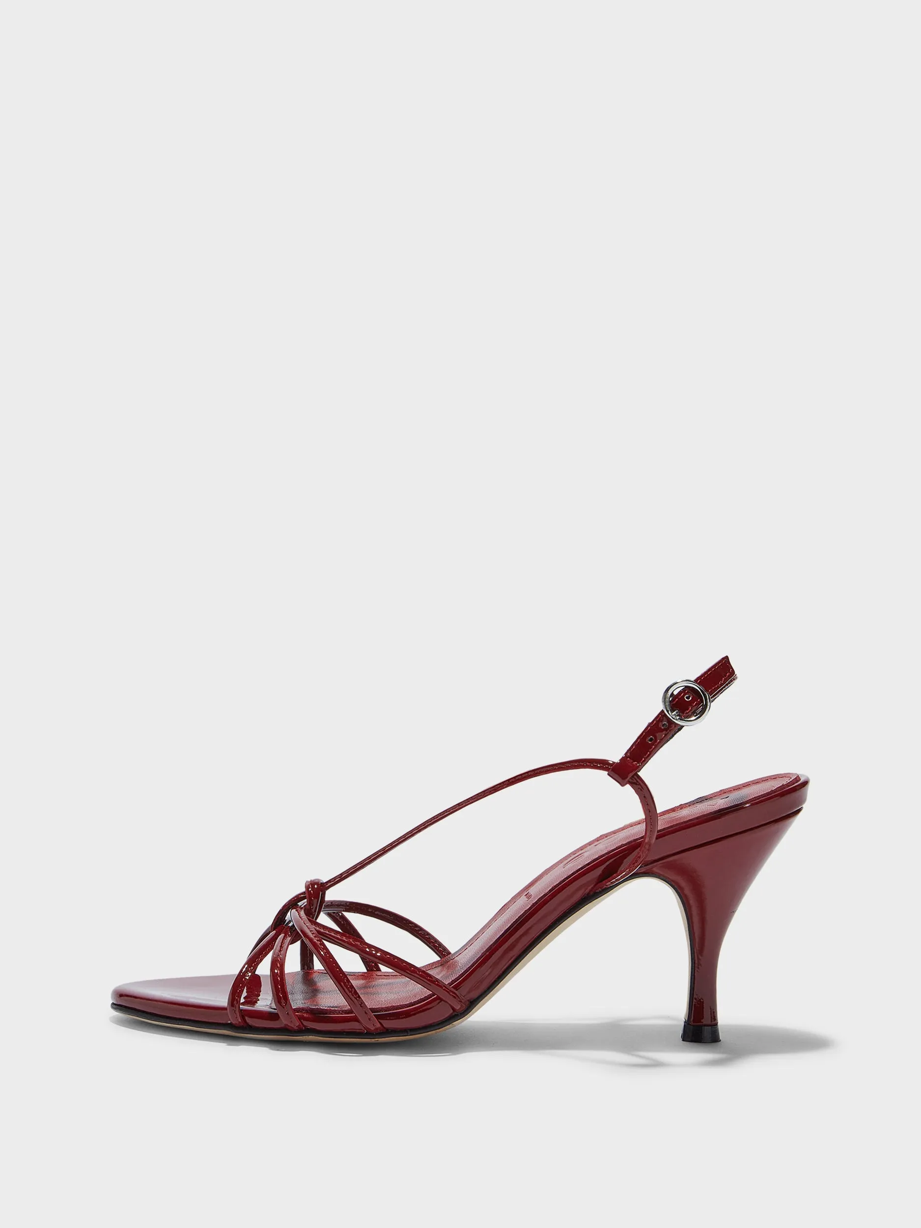 Solange Patent Leather Sandals sold by Aeyde