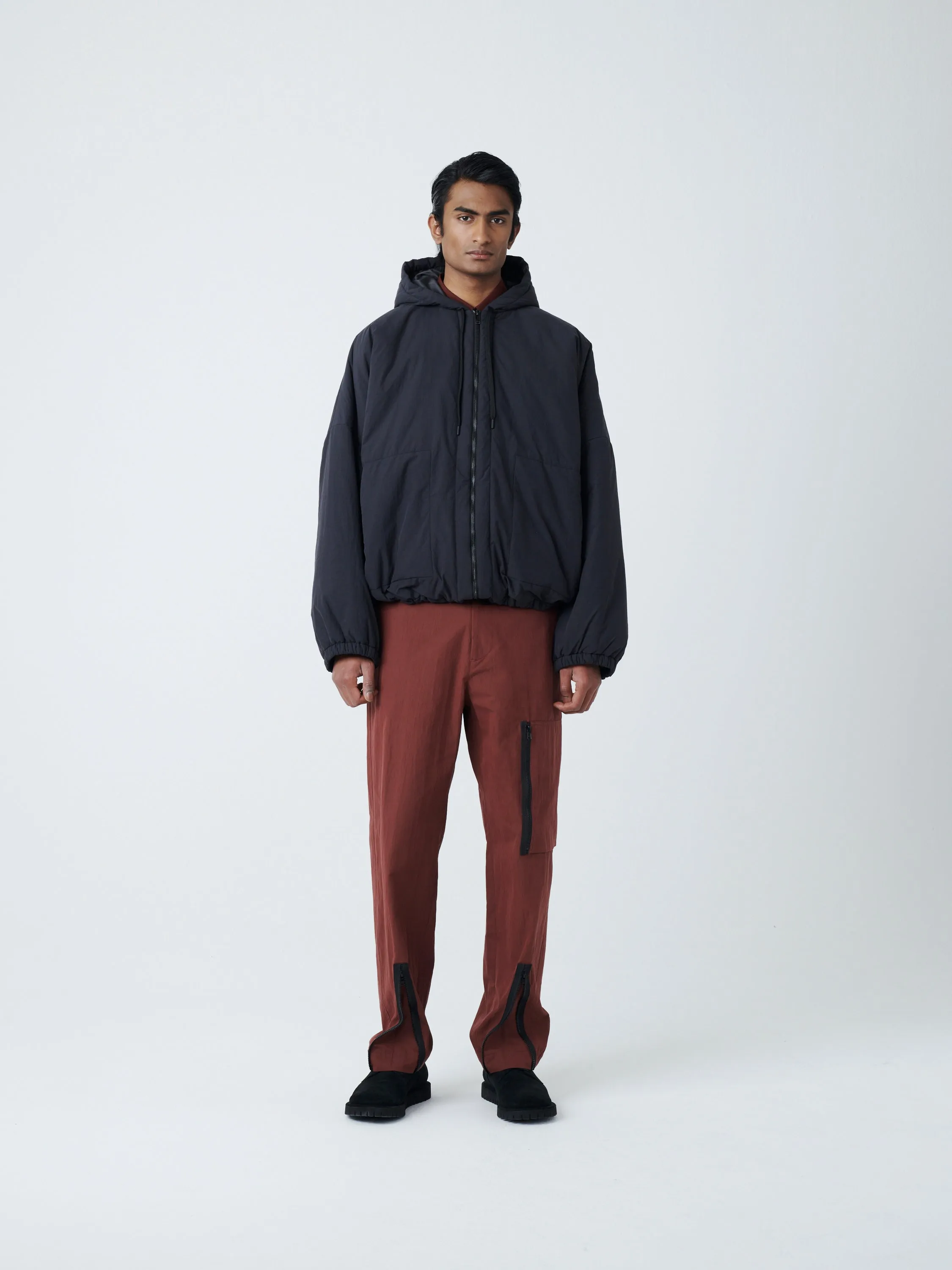 Indus Padded Parka in Black sold by Studio Nicholson