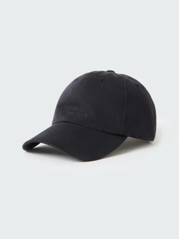 Logo Cap in Darkest Navy sold by Studio Nicholson