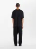 Lay T-Shirt in Black sold by Studio Nicholson