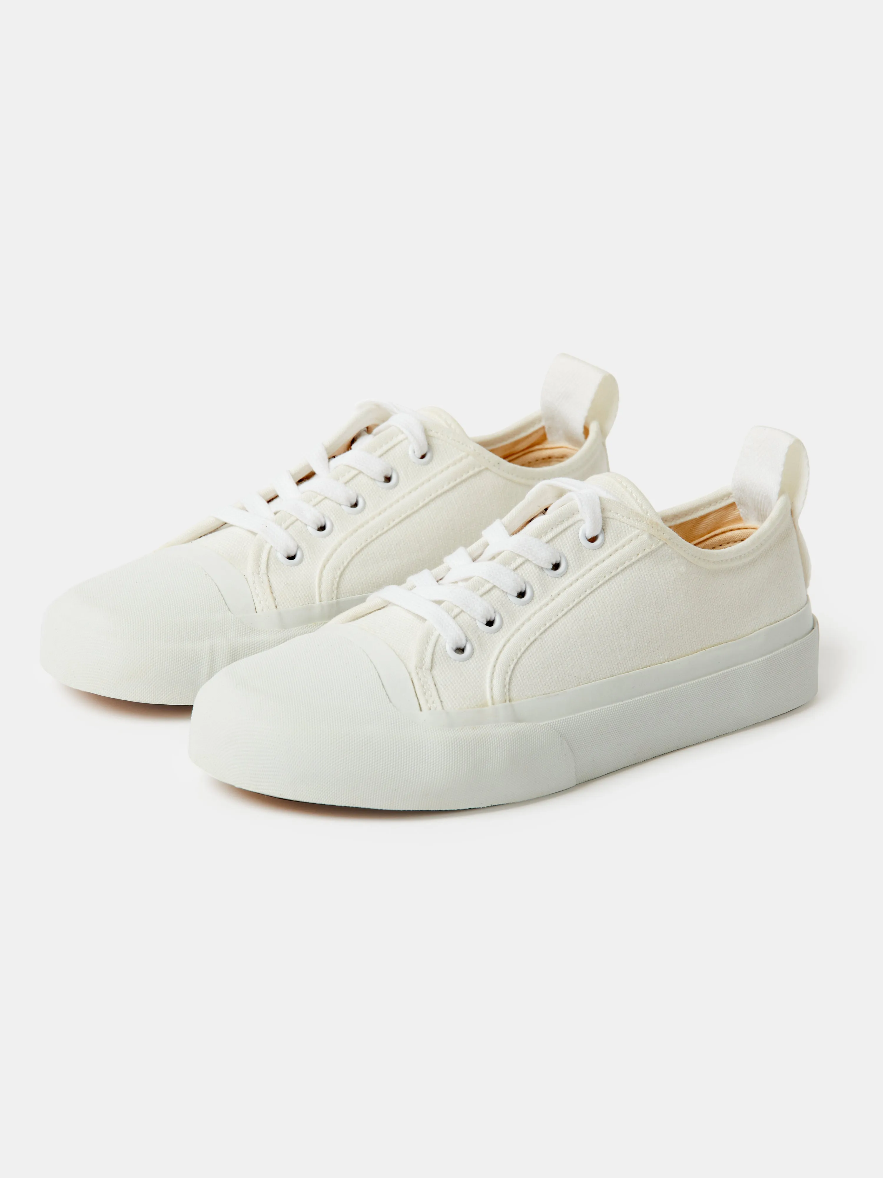 Byrd Canvas Shoe in Cream sold by Studio Nicholson