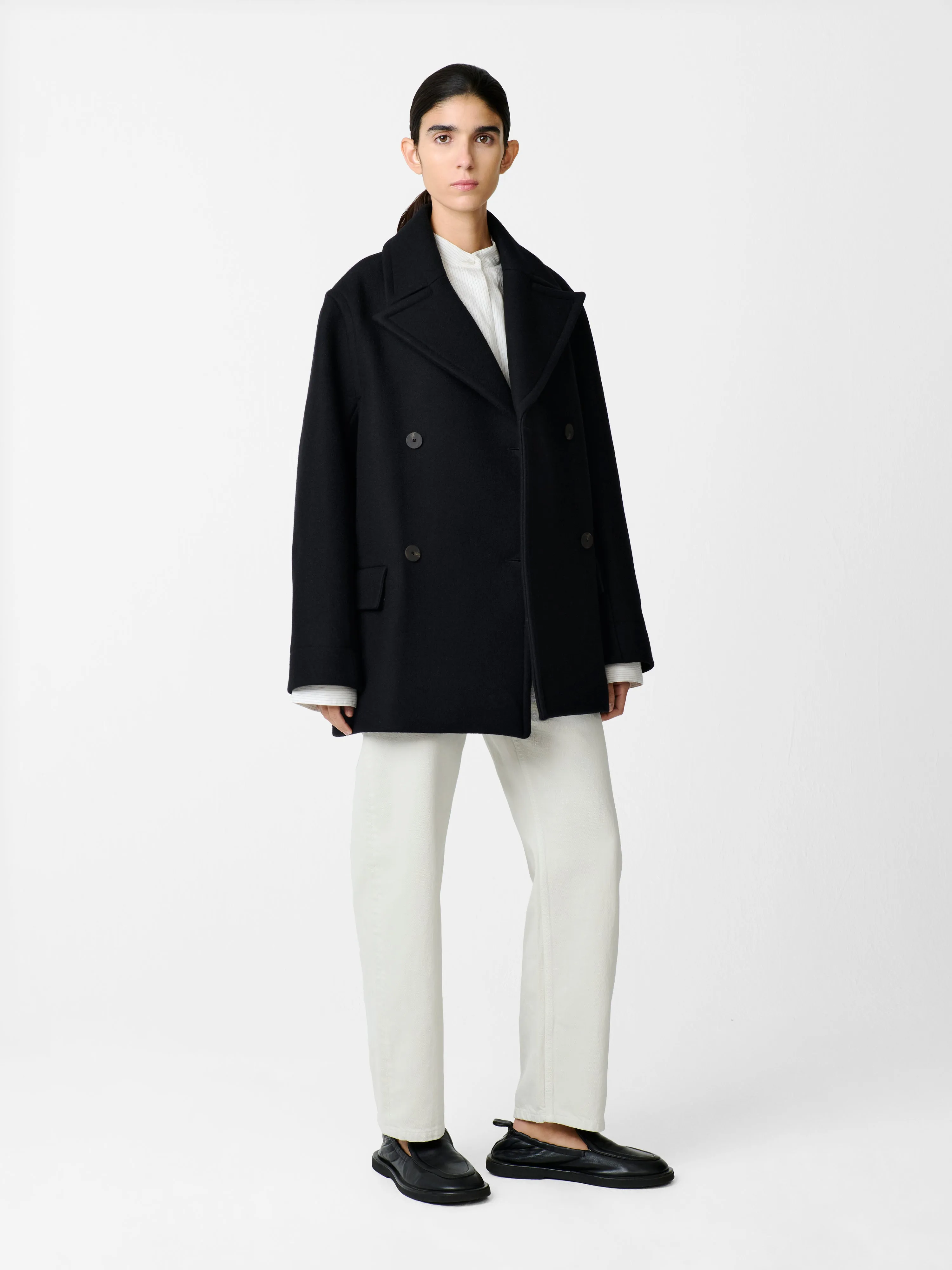 Coles Coat in Black sold by Studio Nicholson